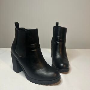 Sleek and edgy black heeled